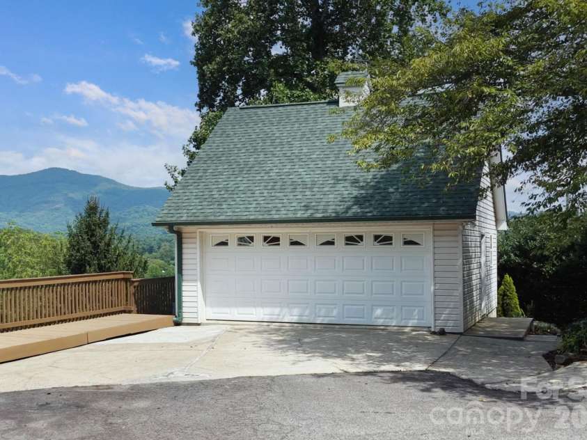 92 Lindon Cove Road, Candler, NC 28715.  MLS# CAR4415627, YatesRealty ID 46224. 2 Car Detached Garage with Storage below