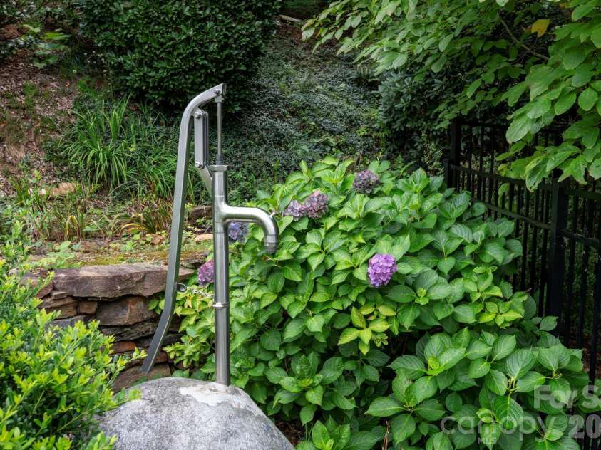 92 Lindon Cove Road, Candler, NC 28715.  MLS# CAR4415627, YatesRealty ID 46224. Bison Manual Hand Pump