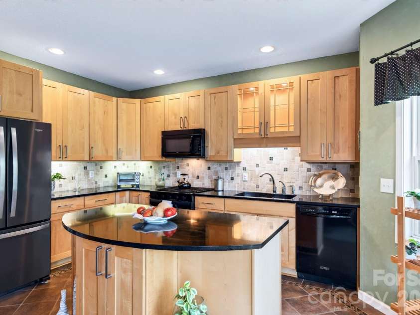 92 Lindon Cove Road, Candler, NC 28715.  MLS# CAR4415627, YatesRealty ID 46224. Kitchen Island with additional storage