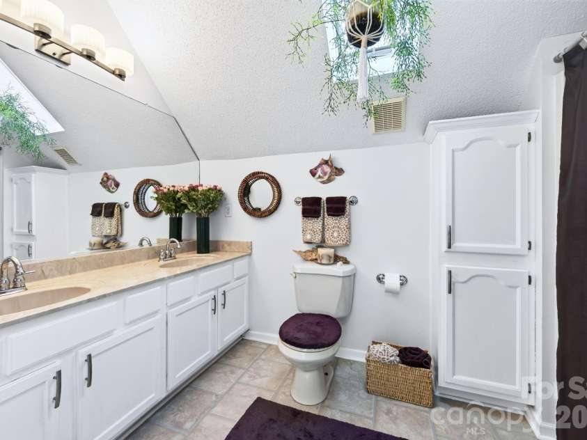 92 Lindon Cove Road, Candler, NC 28715.  MLS# CAR4415627, YatesRealty ID 46224. Shared Upstairs Bathroom Double Vanities