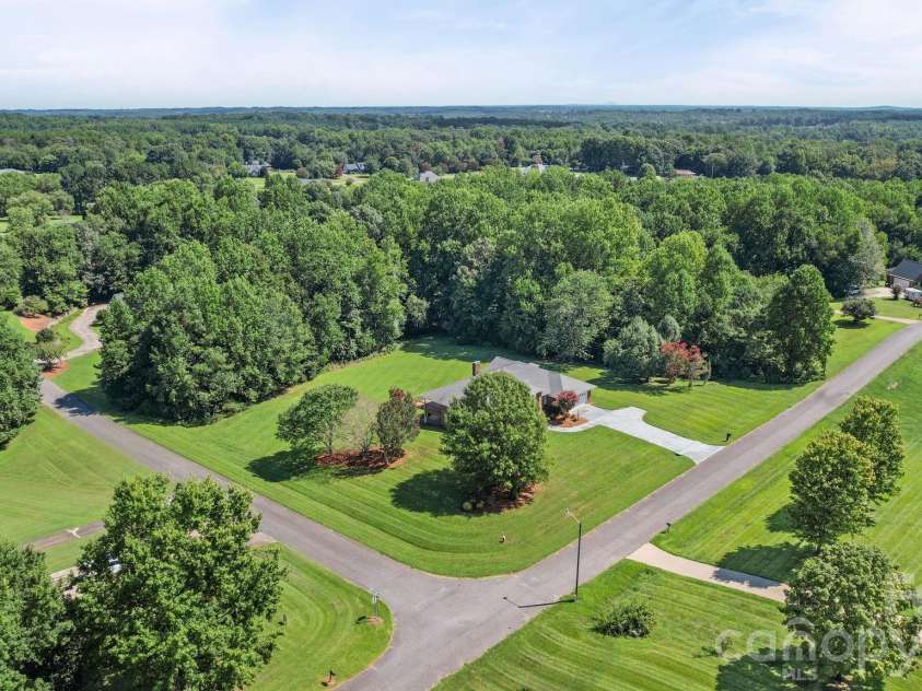 3008 Eaker Drive, Cherryville, NC 28021.  MLS# CAR4410929, YatesRealty ID 46228. Beautiful corner lot with green space, a manicured lawn, and mature trees that provide ample privacy.