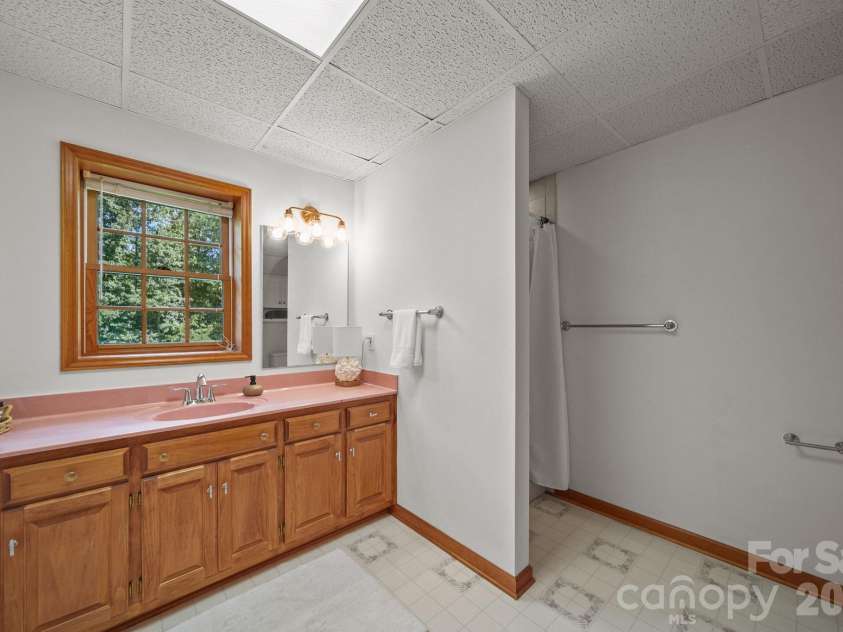 3008 Eaker Drive, Cherryville, NC 28021.  MLS# CAR4410929, YatesRealty ID 46228. Downstairs/basement bathroom with tiled shower.