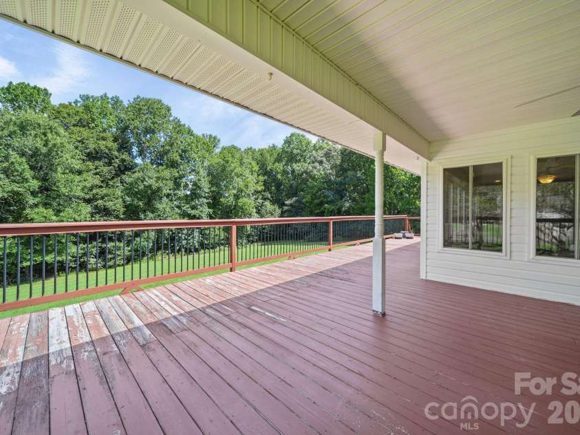 3008 Eaker Drive, Cherryville, NC 28021.  MLS# CAR4410929, YatesRealty ID 46228. Main floor deck with a portion of the deck covered. So much outdoor entertaining space!