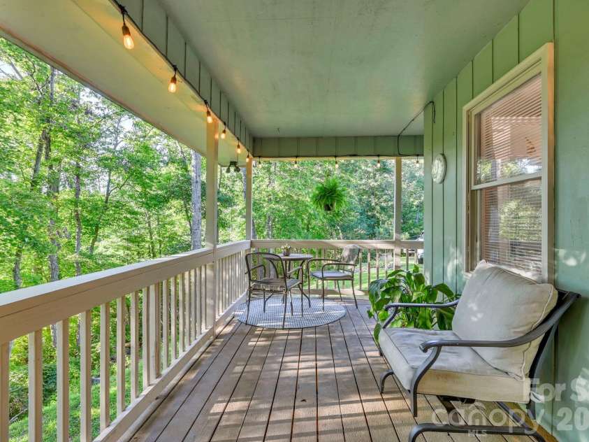 426 Meadowood Lane, Burnsville, NC 28714.  MLS# CAR4412082, YatesRealty ID 46234. Expansive Covered Porch