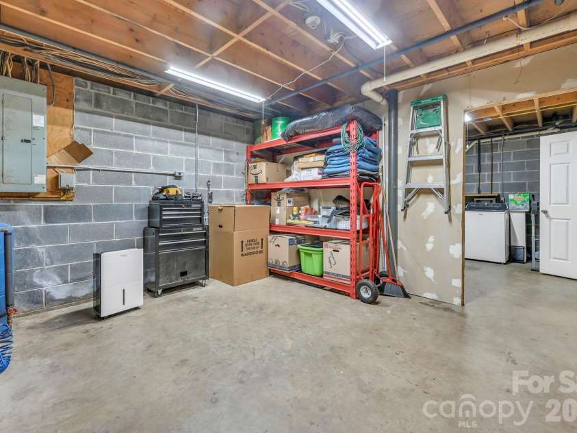 426 Meadowood Lane, Burnsville, NC 28714.  MLS# CAR4412082, YatesRealty ID 46234. Great Basement Storage and Easy Access to Service Items