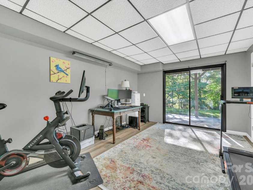 426 Meadowood Lane, Burnsville, NC 28714.  MLS# CAR4412082, YatesRealty ID 46234. Office/Flex Space with Sliding Doors to Patio