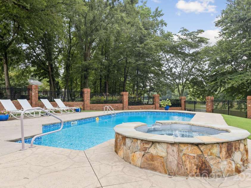 6331 Dovefield Road, Charlotte, NC 28277.  MLS# CAR4318172, YatesRealty ID 46235. Heated saltwater pool and hot tub.