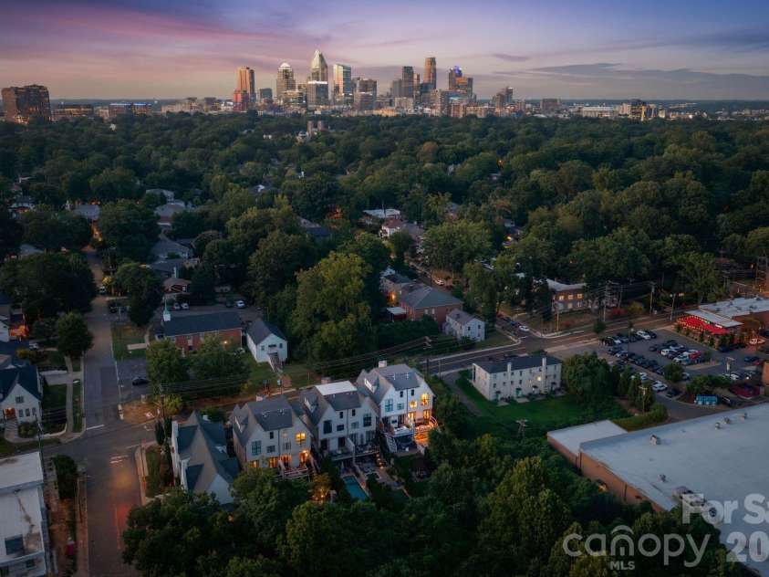 818 Ideal Way, Charlotte, NC 28203.  MLS# CAR4392342, YatesRealty ID 46239. Aerial side view at twilight