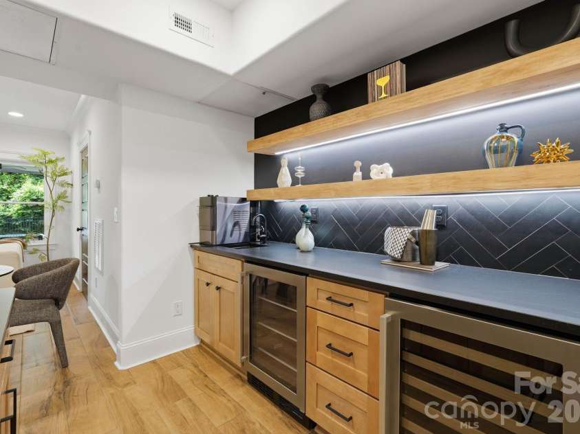 818 Ideal Way, Charlotte, NC 28203.  MLS# CAR4392342, YatesRealty ID 46239. Entertaining area with minibar (lower level)