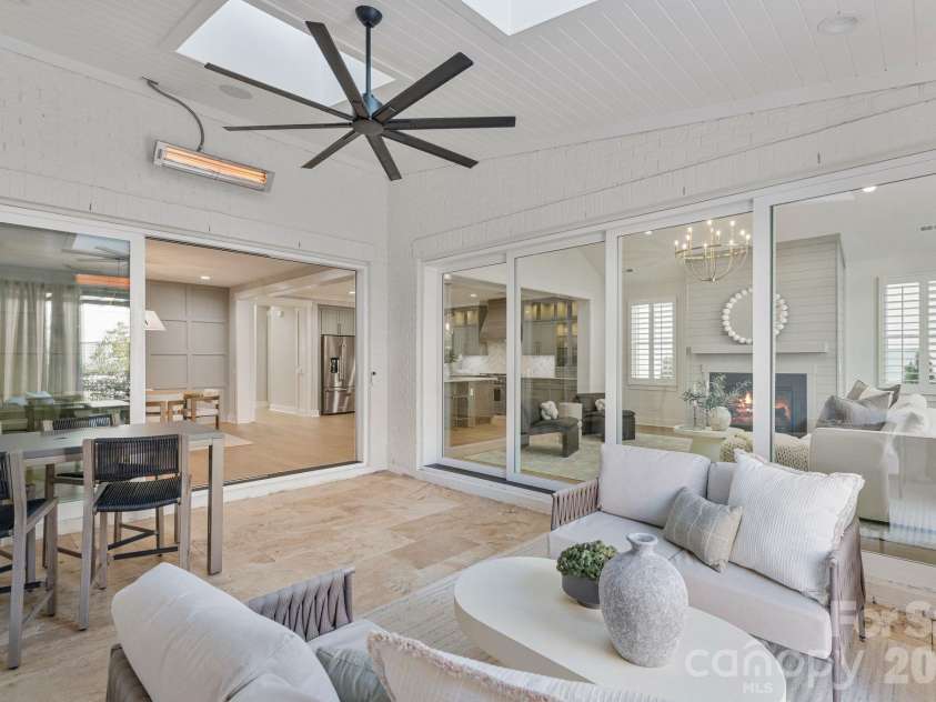 4031 Pritchard Place, Fort Mill, SC 29715.  MLS# CAR4340711, YatesRealty ID 4624. Outside looking in (wired heaters, speakers, and electronic screened porch)