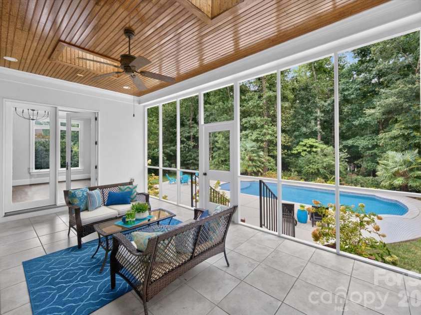 1025 Sherringham Way, Waxhaw, NC 28173.  MLS# CAR4411691, YatesRealty ID 46243. Screened porch with backyard views