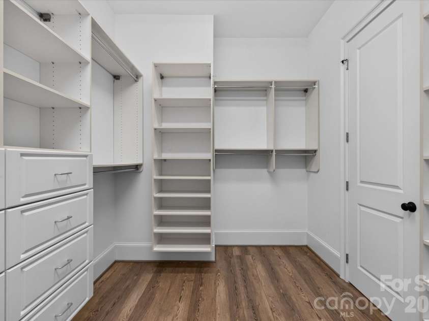 1025 Sherringham Way, Waxhaw, NC 28173.  MLS# CAR4411691, YatesRealty ID 46243. Walk-in closet with custom built-ins