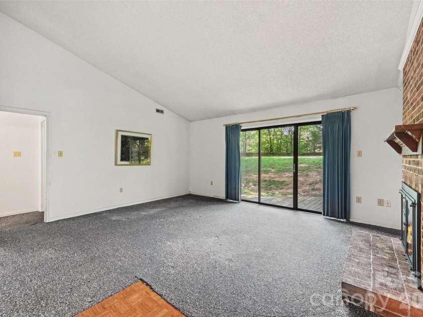 8248 Oakley Lane, Charlotte, NC 28270.  MLS# CAR4417219, YatesRealty ID 46249. Den view from front entryway