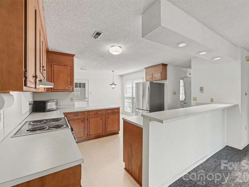 8248 Oakley Lane, Charlotte, NC 28270.  MLS# CAR4417219, YatesRealty ID 46249. Kitchenn view from dining area