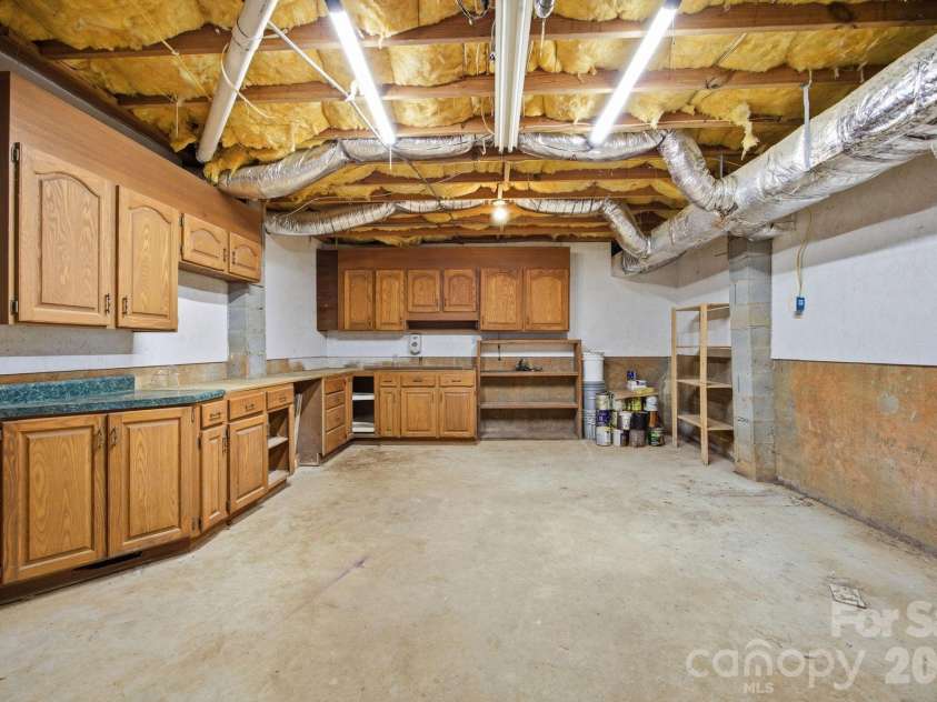195 Azalea Road, Mooresville, NC 28115.  MLS# CAR4381056, YatesRealty ID 46251. Basement workshop