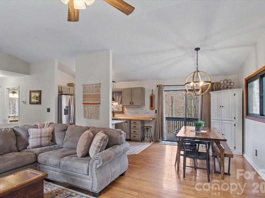30 Whipporwill Drive, Weaverville, NC 28787.  MLS# CAR4344199, YatesRealty ID 46257. Living room flows nicely into dining area and kitchen