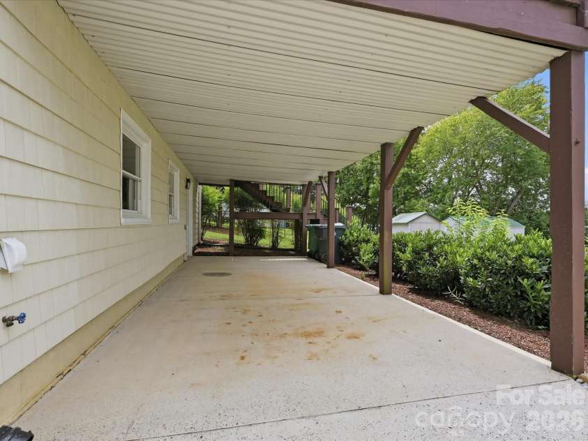 20845 Lagoona Drive, Cornelius, NC 28031.  MLS# CAR4417083, YatesRealty ID 46260. Carport or covered patio area!