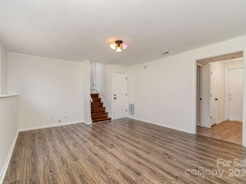 6847 Saddle Point Road, Charlotte, NC 28212.  MLS# CAR4237052, YatesRealty ID 4629. Rec room connected to laundry area and half bath and back door