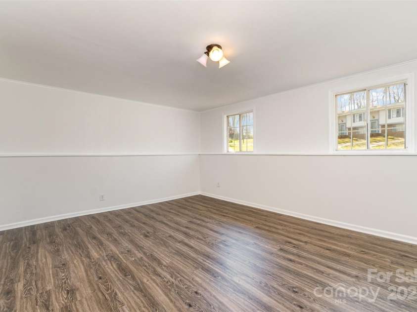 6847 Saddle Point Road, Charlotte, NC 28212.  MLS# CAR4237052, YatesRealty ID 4629. Rec room in lower level