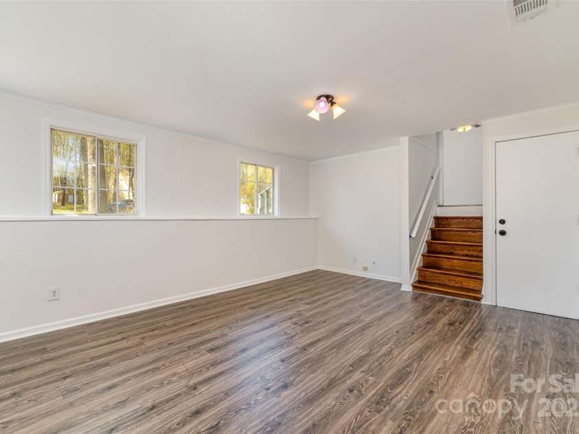 6847 Saddle Point Road, Charlotte, NC 28212.  MLS# CAR4237052, YatesRealty ID 4629. Rec room in lower looking upstairs