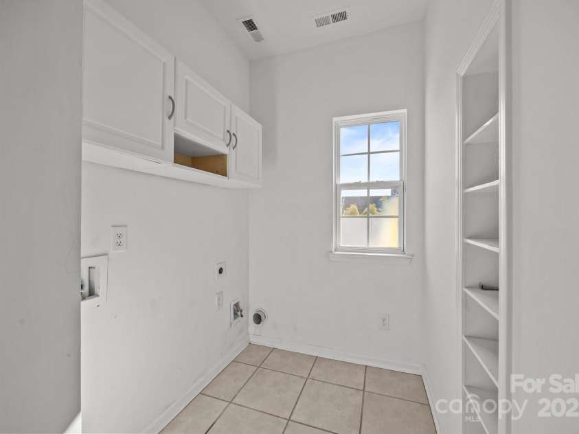 7262 April Mist Trail, Huntersville, NC 28078.  MLS# CAR4240563, YatesRealty ID 4631. Laundry Room w/ Storage Main Level