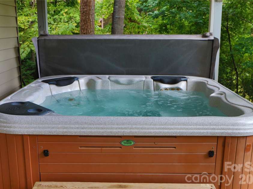 268 Mallard Road, Lake Lure, NC 28746.  MLS# CAR4372270, YatesRealty ID 46317. Hot tub outside basement entry