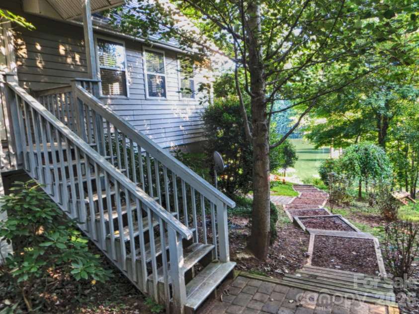 268 Mallard Road, Lake Lure, NC 28746.  MLS# CAR4372270, YatesRealty ID 46317. Side entry. Gently sloping lot to lake.
