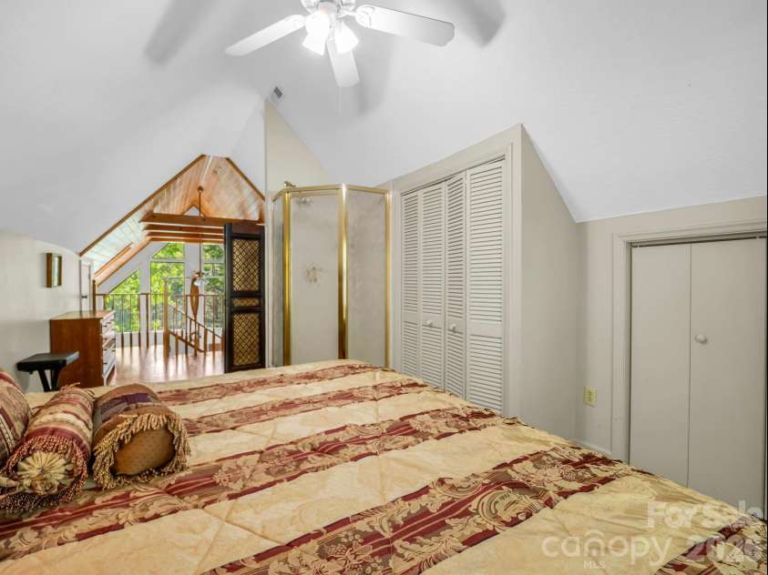 268 Mallard Road, Lake Lure, NC 28746.  MLS# CAR4372270, YatesRealty ID 46317. Upper level primary bedroom