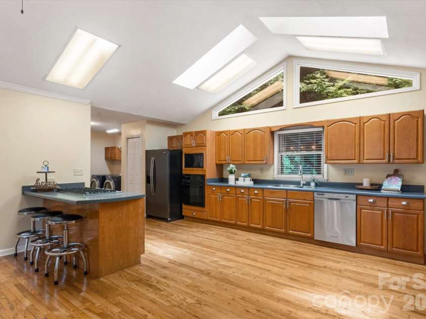 134 Valle Way, Hendersonville, NC 28739.  MLS# CAR4391167, YatesRealty ID 46320. Kitchen-view back of property from windows