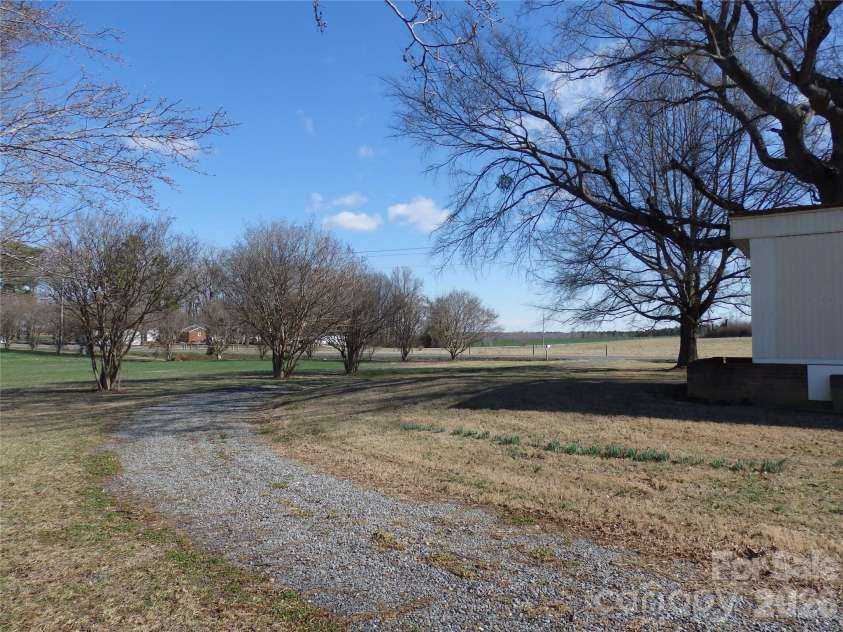 5750 New Hope Road, Denton, NC 27239.  MLS# CAR4350091, YatesRealty ID 4633. Side yard