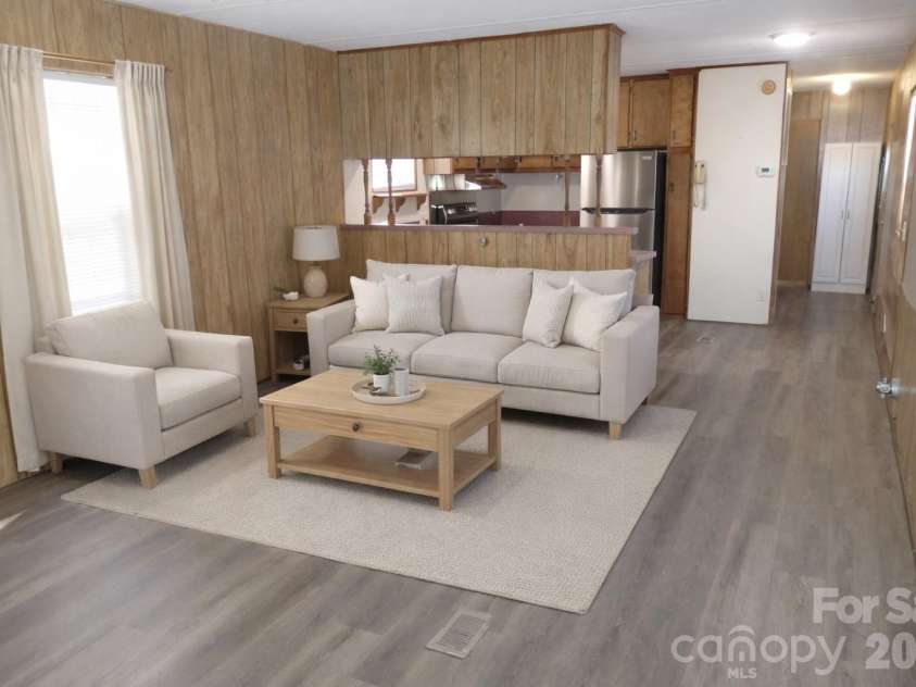 5750 New Hope Road, Denton, NC 27239.  MLS# CAR4350091, YatesRealty ID 4633. Virtually staged living room