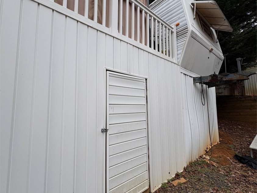 200 Badin View Road, New London, NC 28127.  MLS# CAR4351742, YatesRealty ID 4635. Great storage under deck