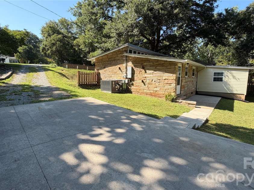 216 Auten Circle, Mount Holly, NC 28120.  MLS# CAR4416875, YatesRealty ID 46378. Concrete parking, sidewalk, patio