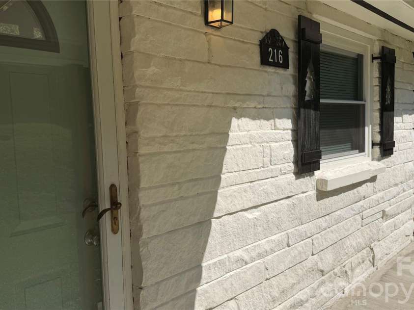 216 Auten Circle, Mount Holly, NC 28120.  MLS# CAR4416875, YatesRealty ID 46378. Front exterior features Romabio Limwashed stone