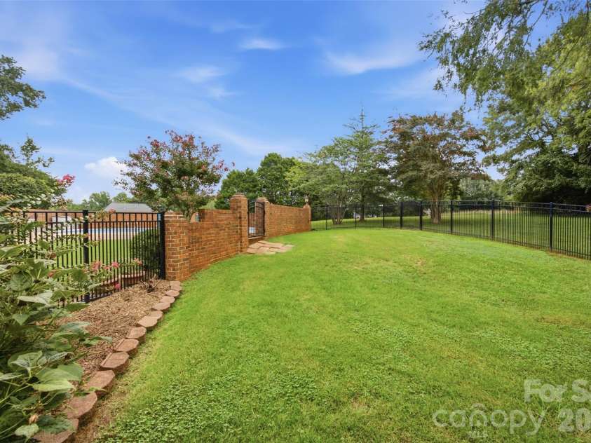 1511 Prancer Lane, Gastonia, NC 28056.  MLS# CAR4412780, YatesRealty ID 46391. Fenced play/pet area protected from pool