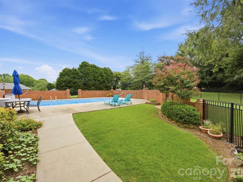 1511 Prancer Lane, Gastonia, NC 28056.  MLS# CAR4412780, YatesRealty ID 46391. Path to pool