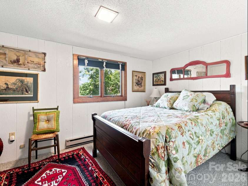 327 Summit Road, Tryon, NC 28782.  MLS# CAR4417439, YatesRealty ID 46395. Basement bedroom