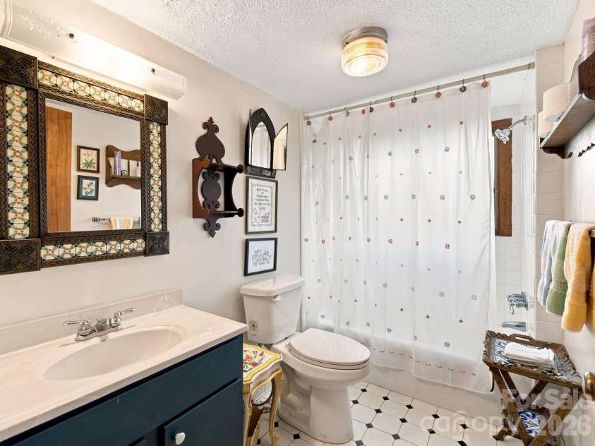 327 Summit Road, Tryon, NC 28782.  MLS# CAR4417439, YatesRealty ID 46395. Basement guest bathroom