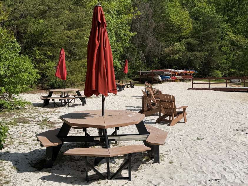 327 Summit Road, Tryon, NC 28782.  MLS# CAR4417439, YatesRealty ID 46395. Beach area with storage for canoes and kayaks