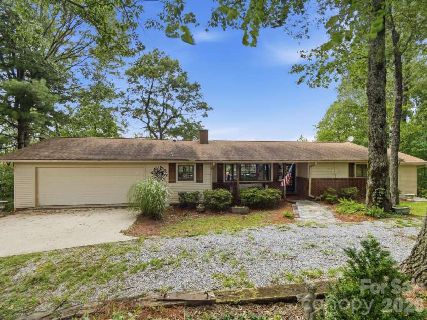 327 Summit Road, Tryon, NC 28782.  MLS# CAR4417439, YatesRealty ID 46395. Circular driveway and two-car attached garage