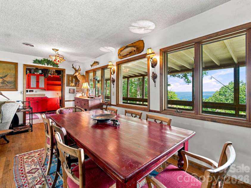 327 Summit Road, Tryon, NC 28782.  MLS# CAR4417439, YatesRealty ID 46395. Dining area looking toward the kitchen