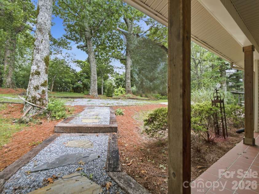 327 Summit Road, Tryon, NC 28782.  MLS# CAR4417439, YatesRealty ID 46395. From the front door looking toward the circular driveway