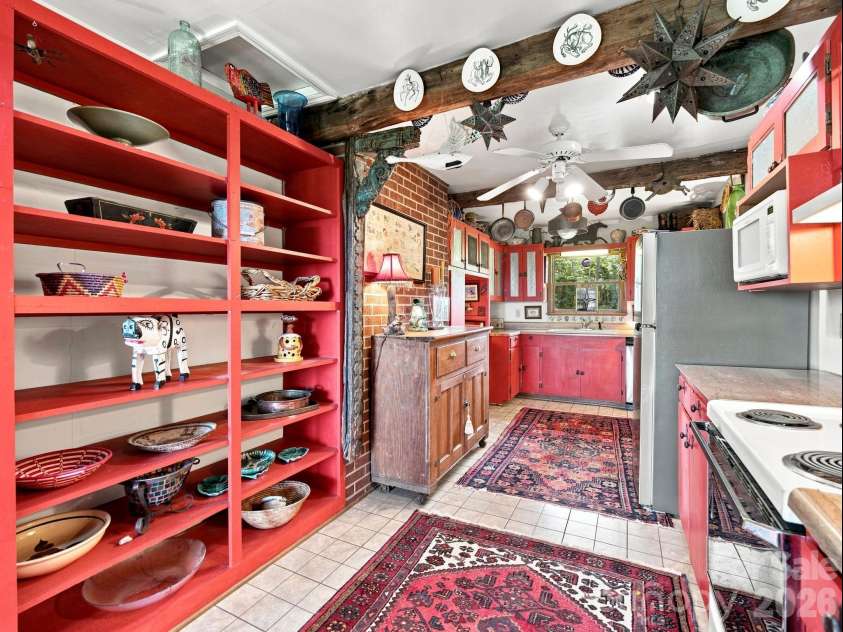 327 Summit Road, Tryon, NC 28782.  MLS# CAR4417439, YatesRealty ID 46395. Plenty of built-in shelves