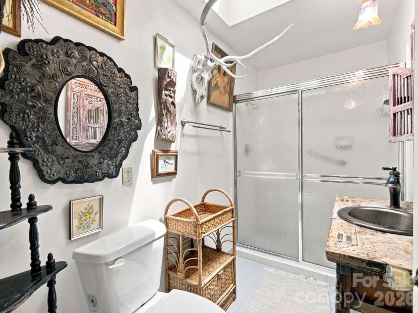 327 Summit Road, Tryon, NC 28782.  MLS# CAR4417439, YatesRealty ID 46395. Primary bathroom with walk-in shower
