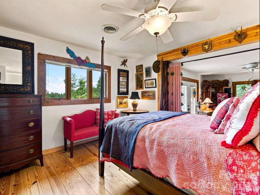 327 Summit Road, Tryon, NC 28782.  MLS# CAR4417439, YatesRealty ID 46395. Primary suite with pine floors