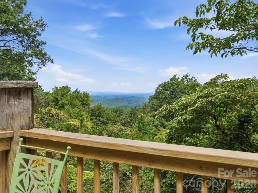 327 Summit Road, Tryon, NC 28782.  MLS# CAR4417439, YatesRealty ID 46395. Private deck off of the primary bedroom
