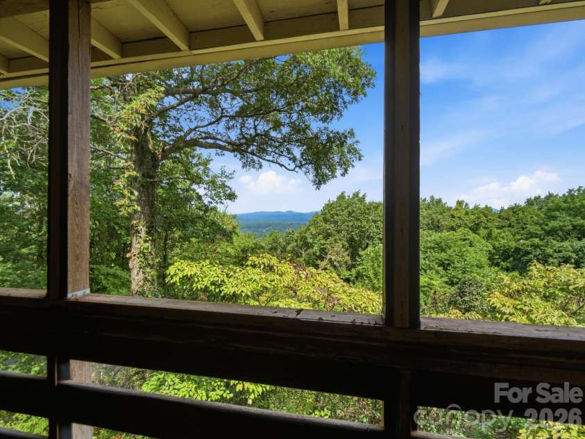 327 Summit Road, Tryon, NC 28782.  MLS# CAR4417439, YatesRealty ID 46395. Views from the screen porch