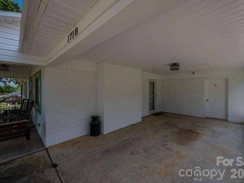 1718 Woolie Road, Lincolnton, NC 28092.  MLS# CAR4417317, YatesRealty ID 46404. Carport with storage area