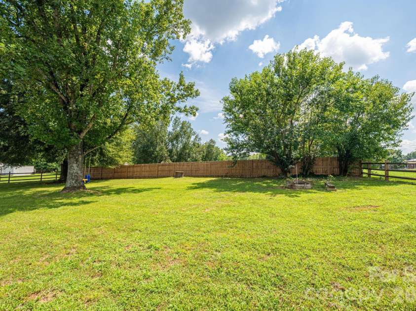 1718 Woolie Road, Lincolnton, NC 28092.  MLS# CAR4417317, YatesRealty ID 46404. Large back yard- fenced