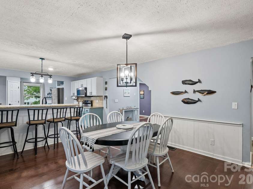 4 Beechwood Lakes Drive, Hendersonville, NC 28792.  MLS# CAR4380923, YatesRealty ID 46410. Another ample eating area is located in the open space between the kitchen and den.